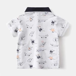 Close-up of breathable pique cotton fabric with cartoon crocodile prints on polo shirt