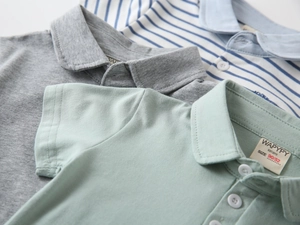 Close-up of cotton polo shirts showing collars, buttons and soft knitted textures