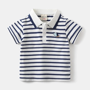 Detail of white striped polo shirt for boys with cartoon dog embroidery and navy stripes
