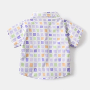 Detail view of the neat back stitching on a colorful plaid short-sleeve shirt for boys