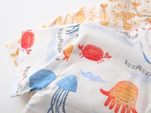 Detail of cotton kids short sleeve shirt with colorful sea creature cartoon print