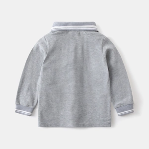 Rear view showing fabric texture and white stripes on boys' gray long-sleeve polo shirt