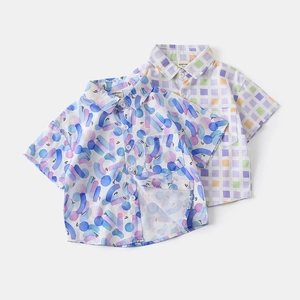Detail of short sleeve shirts for boys with abstract wave patterns and chess textures