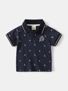 Boys navy blue polo shirt with star and sailboat print featuring a classic collar design