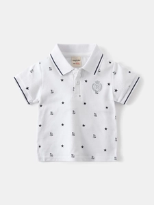 Boy's white cotton polo shirt with star and sailboat prints and navy striped collar
