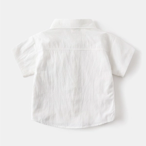 Rear view of white boys short sleeve shirt showing pleated cotton fabric and shoulder yoke