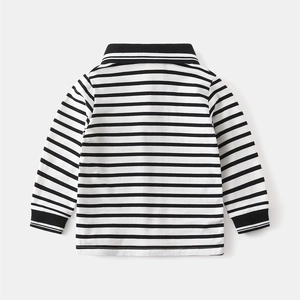 Detailed flat lay of boys striped long-sleeve polo shirt with black ribbed cuffs