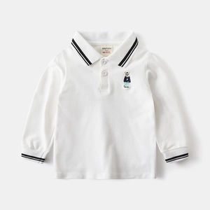 Detail of white cotton polo shirt featuring polo bear embroidery and striped collar