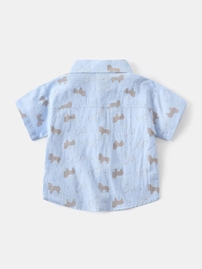 Boys short sleeve blue shirt with all-over horse print and classic collar detail