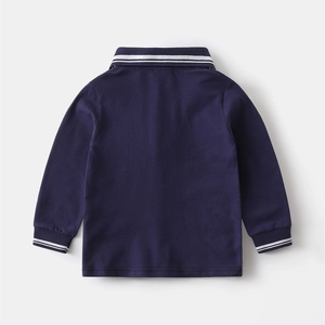 Rear view of navy blue cotton boys polo shirt with white stripes on collar and cuffs