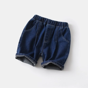 Detail of boys' dark blue denim shorts with elastic waist and stylish cuffed hems