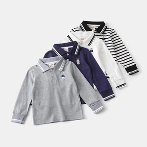 Flat lay of boys' long sleeve Polo shirts set featuring bear embroidery and rib cuffs
