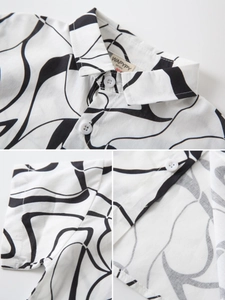 Chemise garçon à manches courtes avec motifs de vagues noirs et détails de boutons blancs