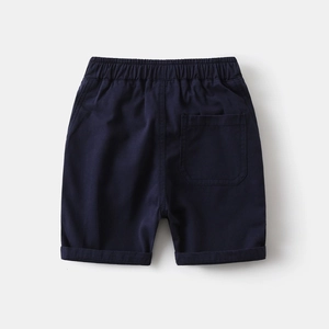 Detail of navy blue cotton shorts featuring an elastic waistband and back pocket detail