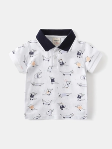 White cotton boys' polo shirt with all-over cartoon crocodile print and navy collar