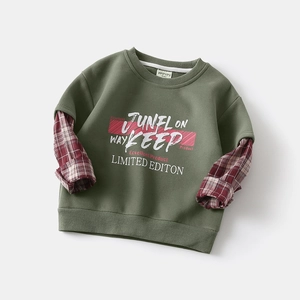 Detail of army green boys hoodie with faux layered red checkered sleeves and graphic print