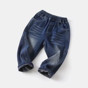 Detail of boys' denim pants showing elastic waistband and vintage faded wash texture
