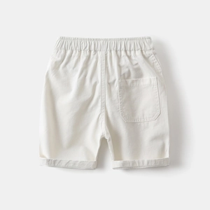 Detail of boys' white cotton shorts featuring elastic waist and back pocket
