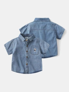Short sleeve denim shirt for boys featuring a bear embroidery and classic light wash blue