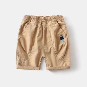 Detail of khaki cotton shorts featuring elastic waist and cute bear embroidery on the pocket