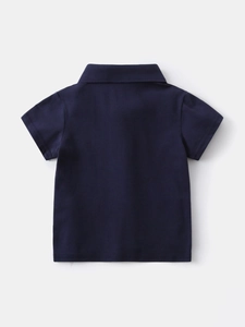 Classic navy blue boys cotton polo shirt with a stylish flat lay back view design