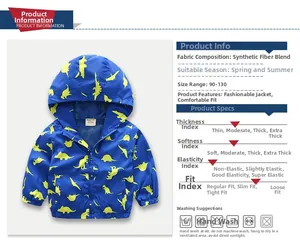 Close-up of lightweight blue hooded jacket for boys with yellow dinosaur cartoon print