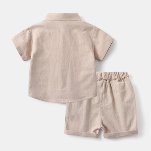 Back view of kids beige cotton linen summer set showing shirt and elastic shorts texture