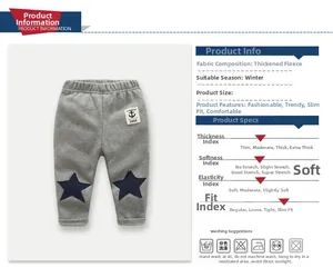 Detailed view of gray winter fleece trousers with star patch and elastic waistband