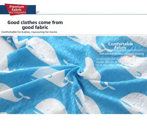 Detail of blue breathable fabric with white whale print and soft seersucker texture