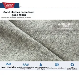 Macro detail of gray knit fabric showing texture, stretch, and wrinkle resistance