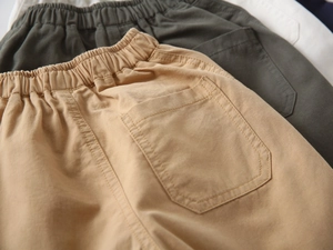 Close-up of boys cotton shorts showing elastic waist design and twill fabric texture