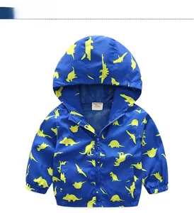 Detail of boys blue hooded jacket with yellow dinosaur print and breathable mesh lining