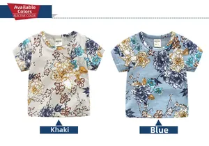 Flat lay of boys short-sleeve t-shirts in khaki and blue with retro floral prints