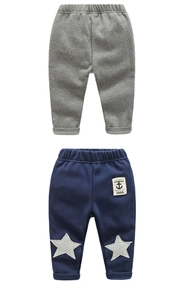 Detailed view of elastic waistband and star patches on kids fleece joggers