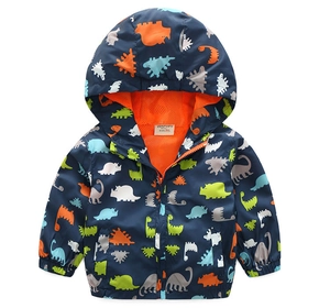 Detail of boys navy dinosaur jacket with orange mesh lining and size 90 label
