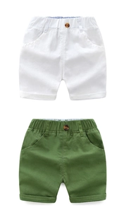 Detail of kids cotton shorts featuring elastic waist with buttons and rolled cuffs