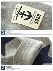 Detail of baby winter trousers showing anchor patch embroidery and warm fleece lining texture