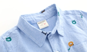 Blue oxford cotton shirt for baby boys featuring colorful cartoon bear print all over