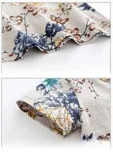 Macro detail of toddler t-shirt showing floral print fabric texture and neat hem stitching