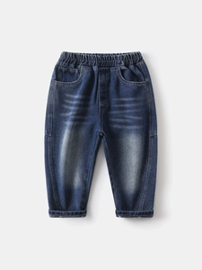 Classic dark blue boys denim jeans with elastic waist and washed vintage whiskers finish