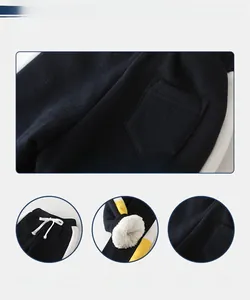 Detail of boys fleece-lined joggers featuring elastic drawstring waist and ribbed cuffs