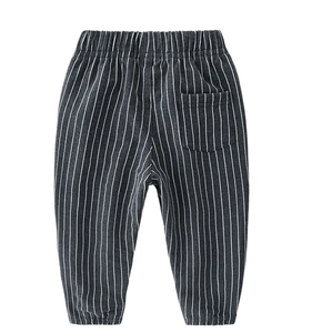 Detailed macro view of children striped casual pants showing ribbed cuffs and back pocket