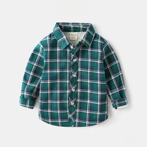Close-up of boys thick green plaid shirt showing soft white fleece lining detail