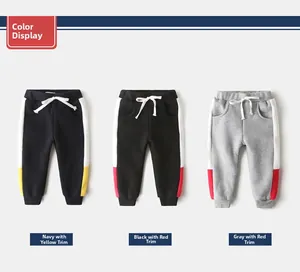 Detail view of boys fleece lined joggers featuring elastic waist and contrast side stripes