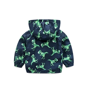 Back view of boys hooded jacket featuring green geometric dinosaur prints on dark blue