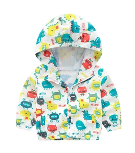 Detail of kids hooded windbreaker featuring mesh lining and colorful dinosaur print