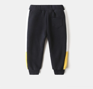 Detail of dark blue boys joggers with yellow and white side stripes and ribbed cuffs