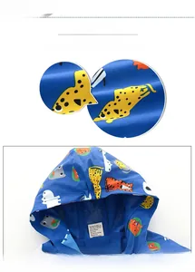 Detail of kids hooded windbreaker with animal prints and breathable mesh lining inside