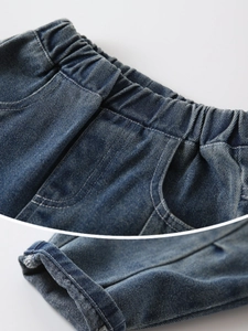 Boy's vintage blue wash denim jeans with elastic waistband and detailed stitching