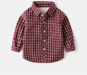 Detailed view of winter boy's warm flannel plaid shirt with white fleece lining and soft collar
